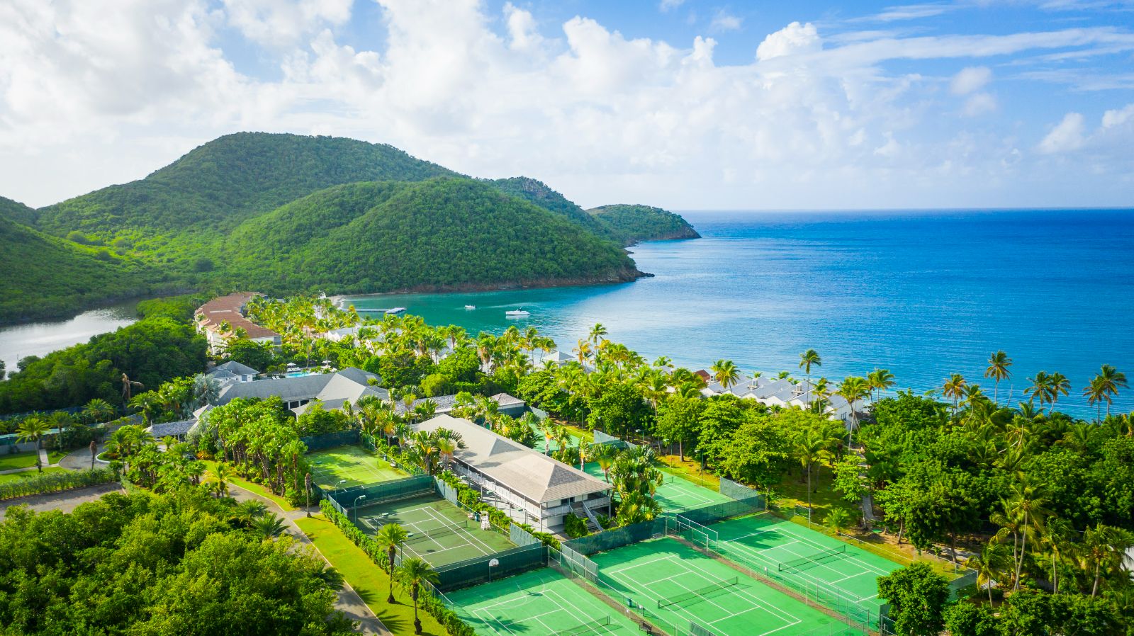 Tennis courts and view of Carlisle Bay resort in Antigua