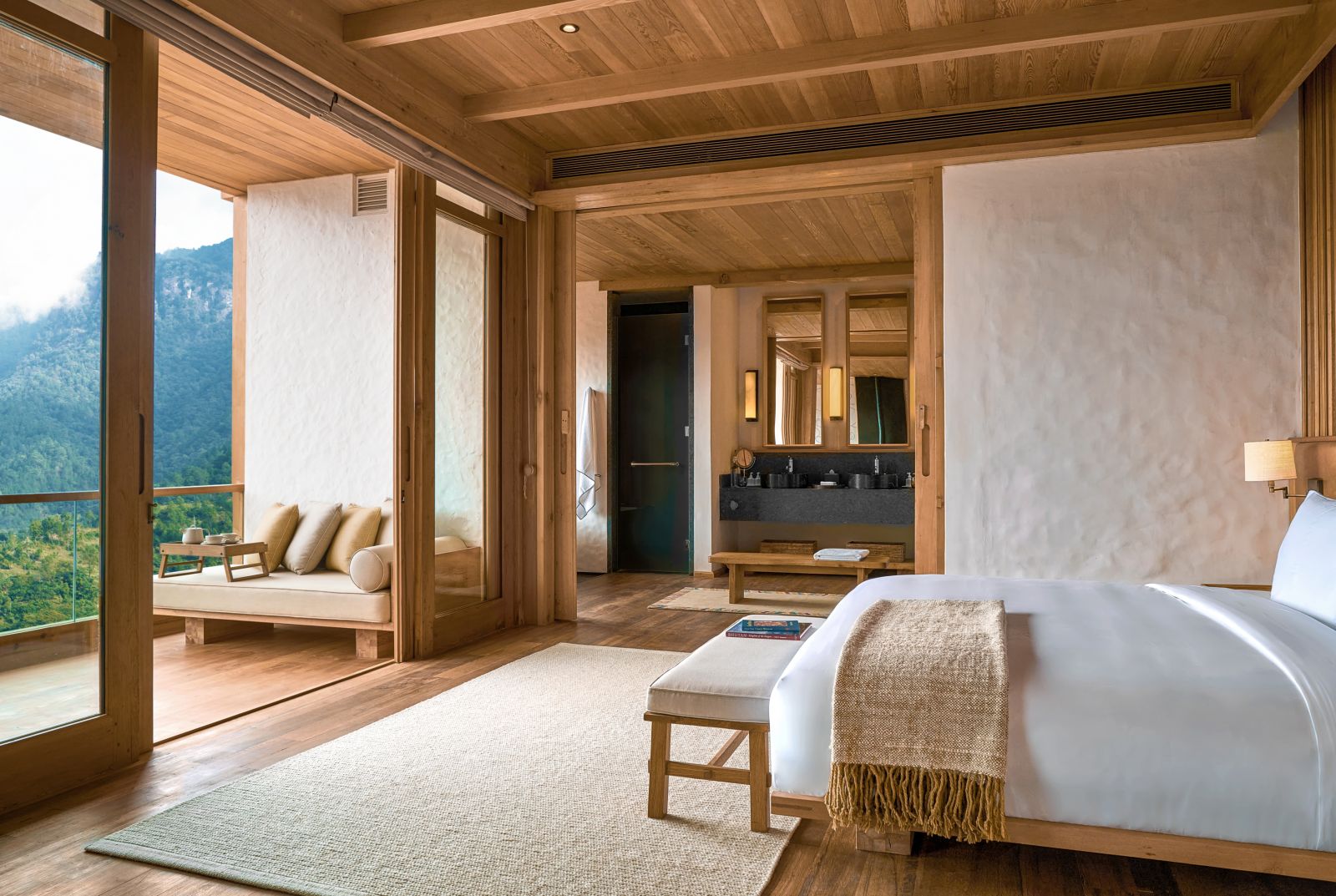 Master bedroom at Lodge Suite with balcony at Six Senses Thimpu