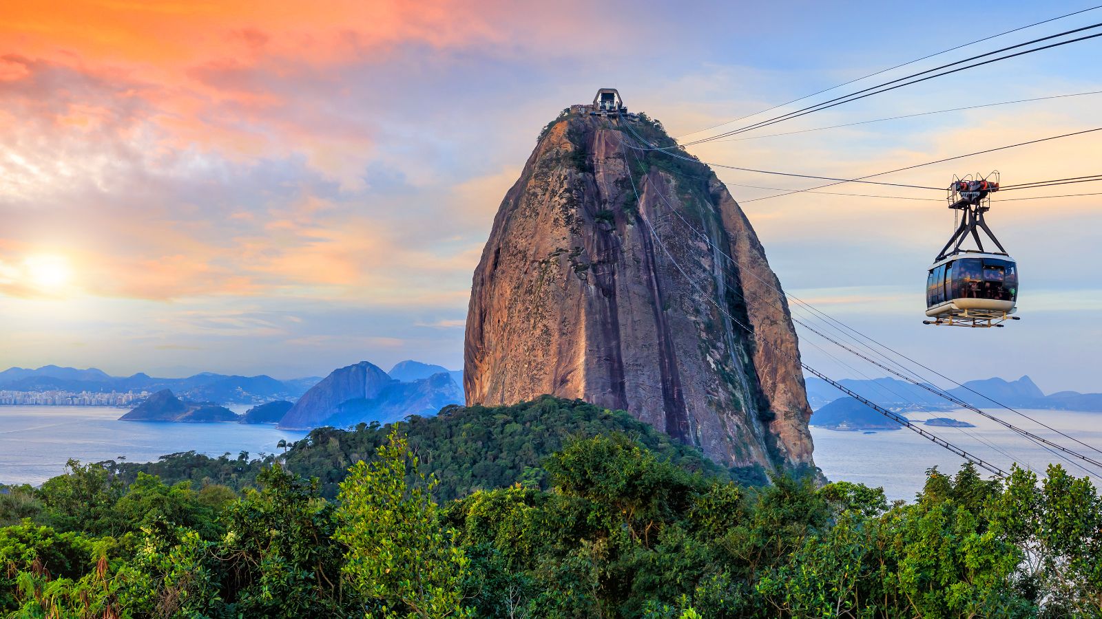 Cable car going up Sugarloaf Mountain in Rio de Janeiro Brazil during sunset