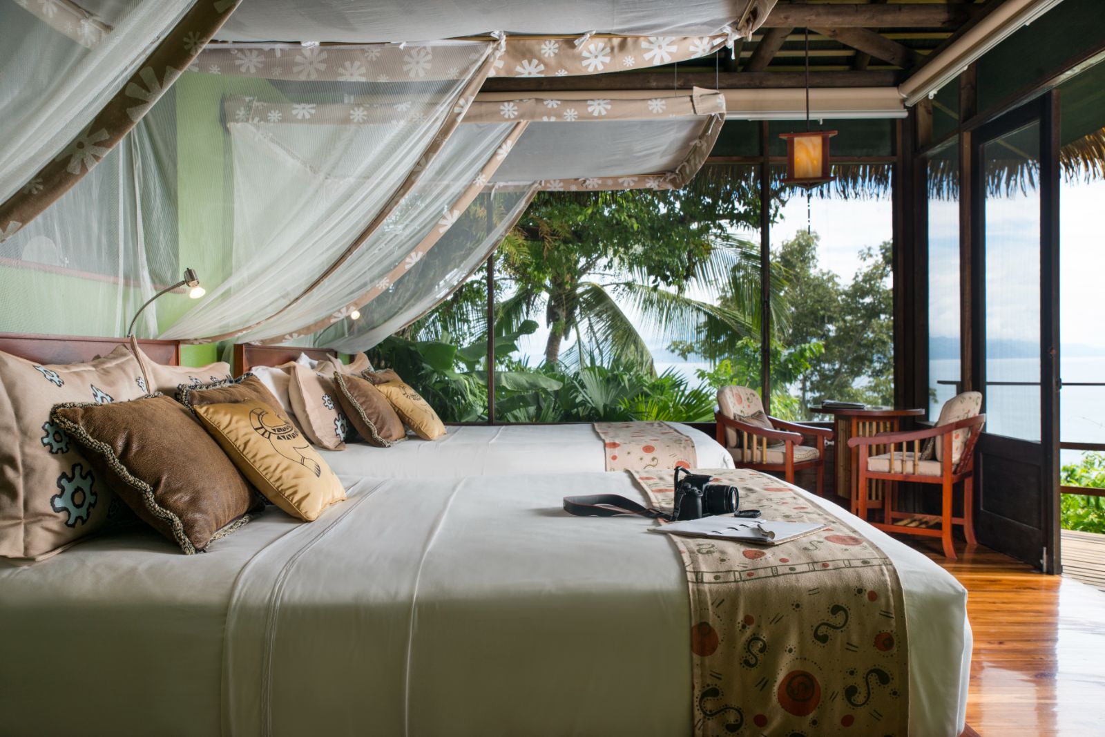 Villa guest suite bed at Lapa Rios resort in Costa Rica