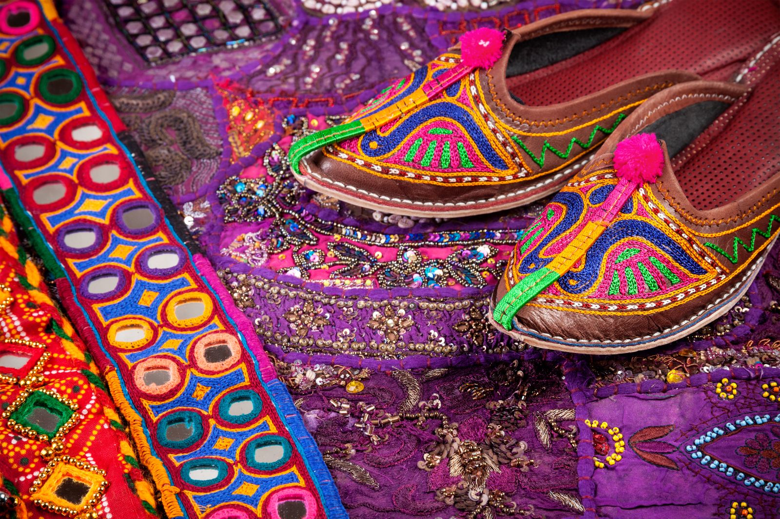 Colourful ethnic shoes and belts at flea market in Rajasthan India