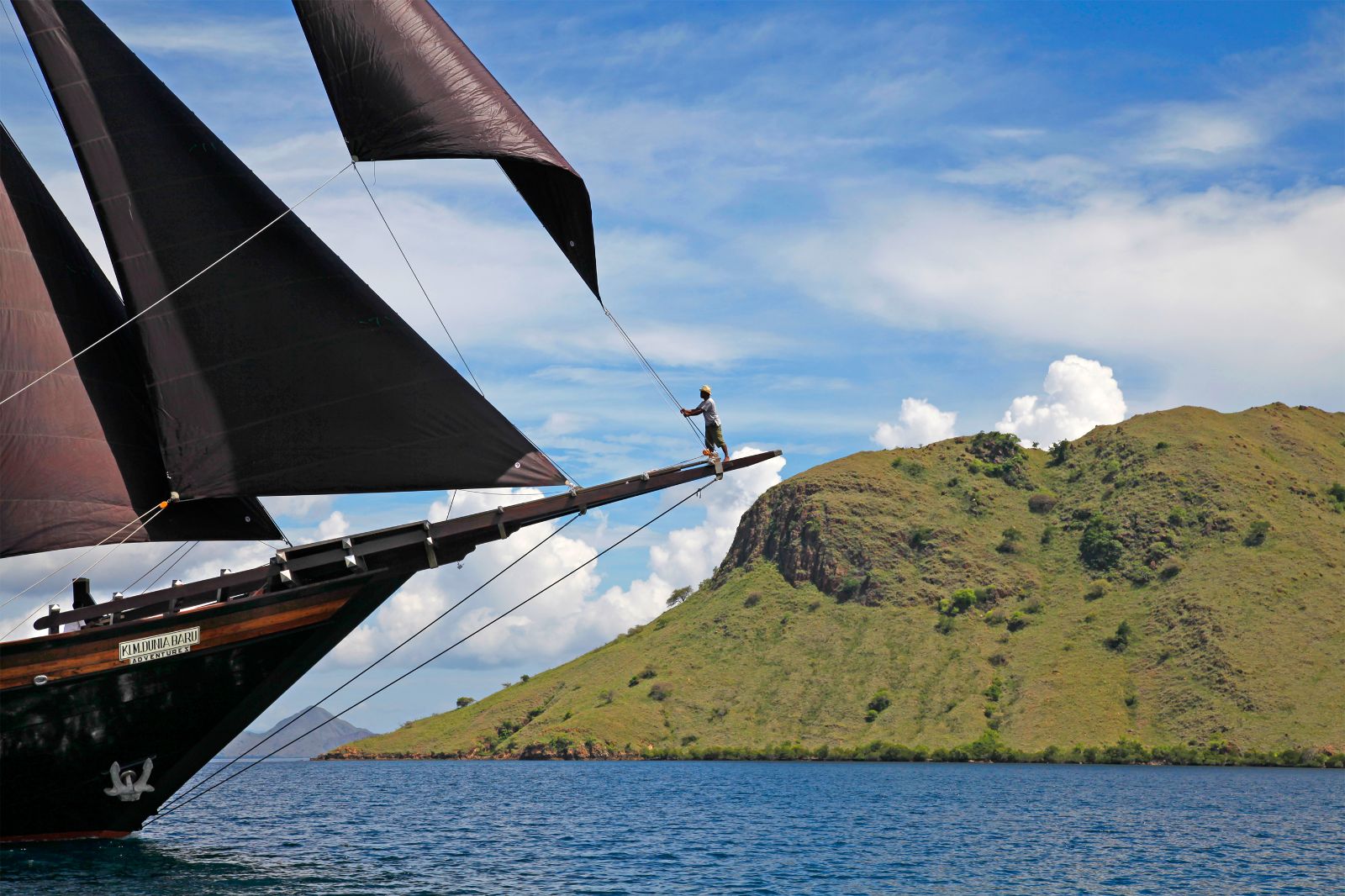 Dunia Baru phinisi on the waters of the Komodo Islands in Indonesia