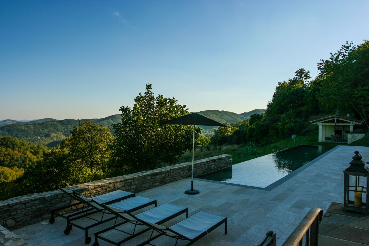 The views of rolling hills beyond the infinity pool at La Spighetta.