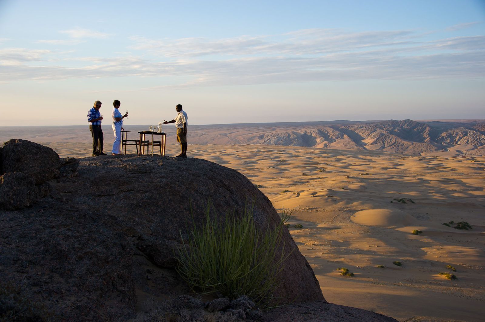 Sundowners overlooking the desert during a stay at luxury lodge Serra Cafema in Kakaoland, Namibia