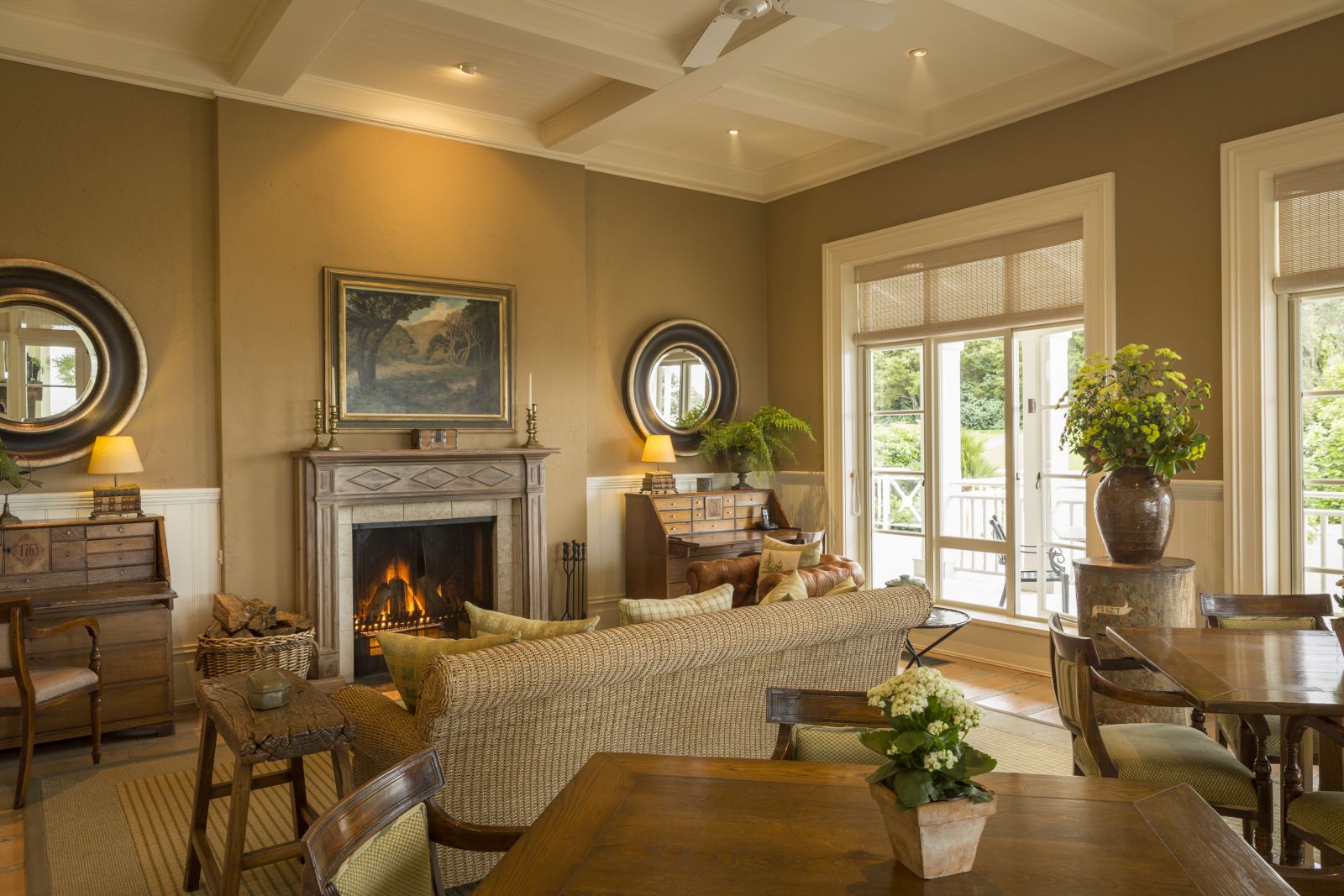 Cosy lounge at Kauri Cliffs with a fireplace