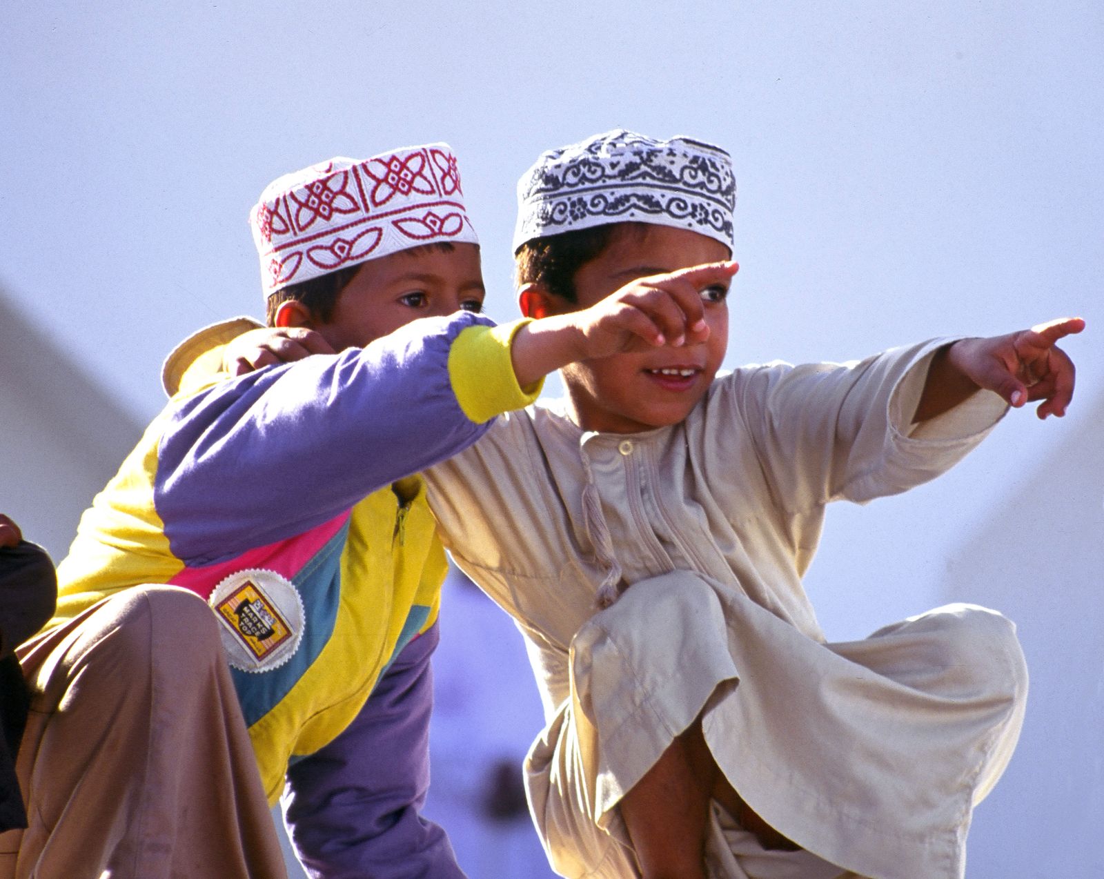 Local children wearing traditionall garments in Oman