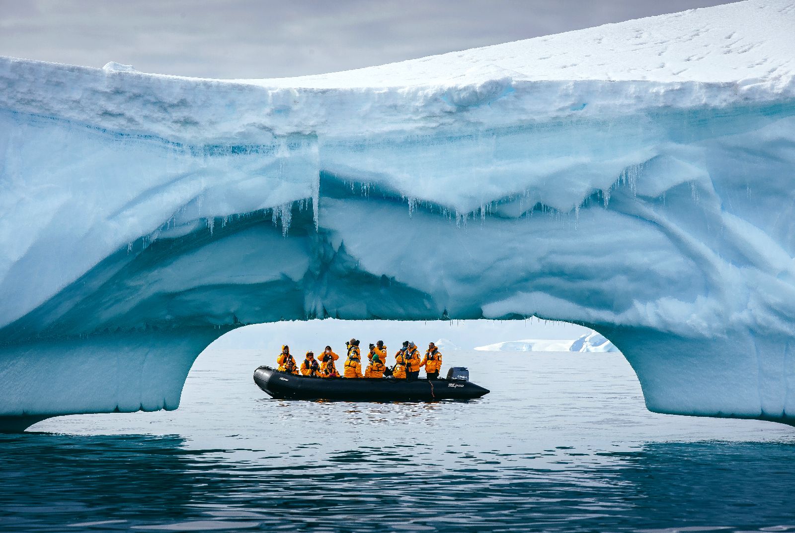 Quark Zodiac seen through the arch of an iceberg in Antarctica