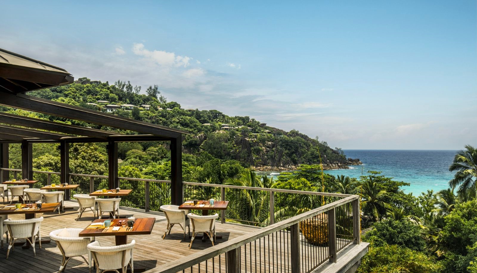 Restaurant terrace overlooking the ocean at Four Seasons Seychelles