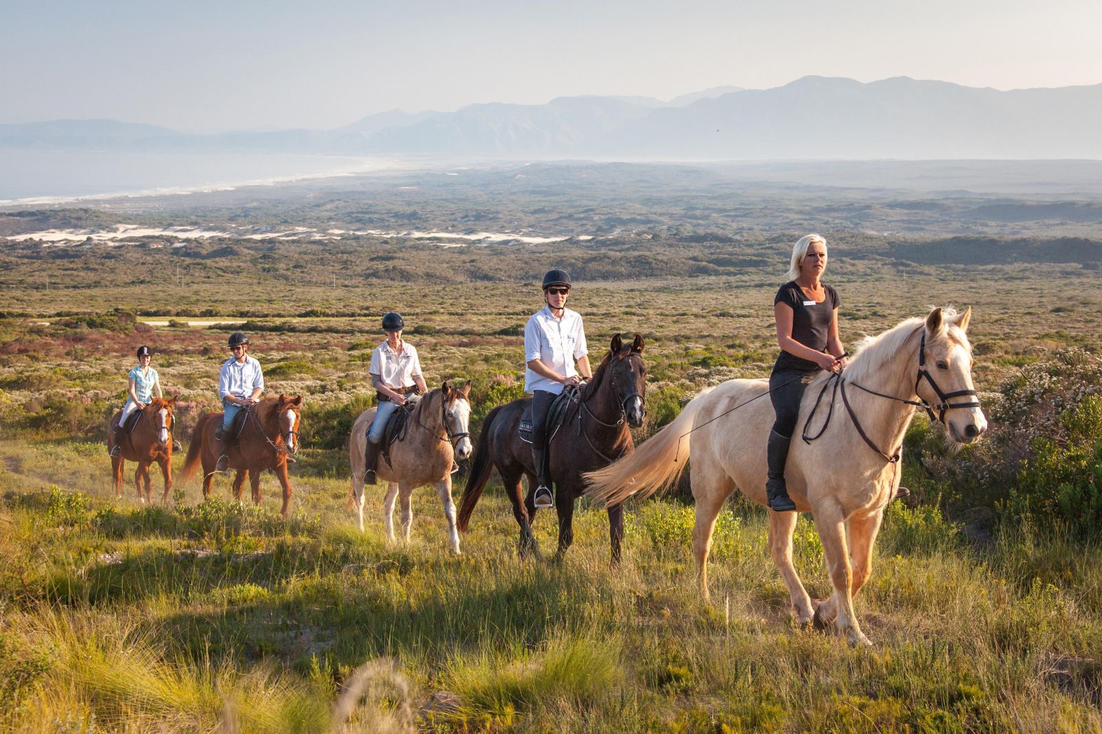 Guests enjoying a horse riding tour during a stay at luxury reserve Grootbos in South Africa