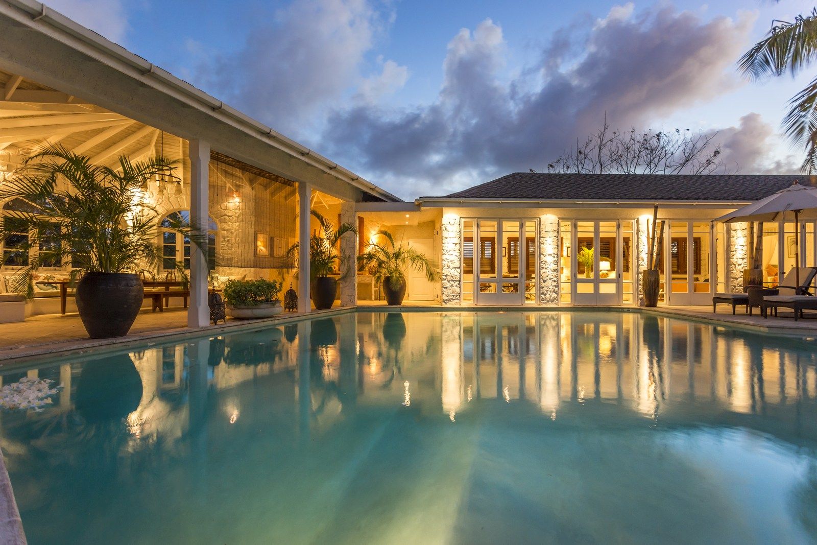Pool at night at The Cotton House, Mustique