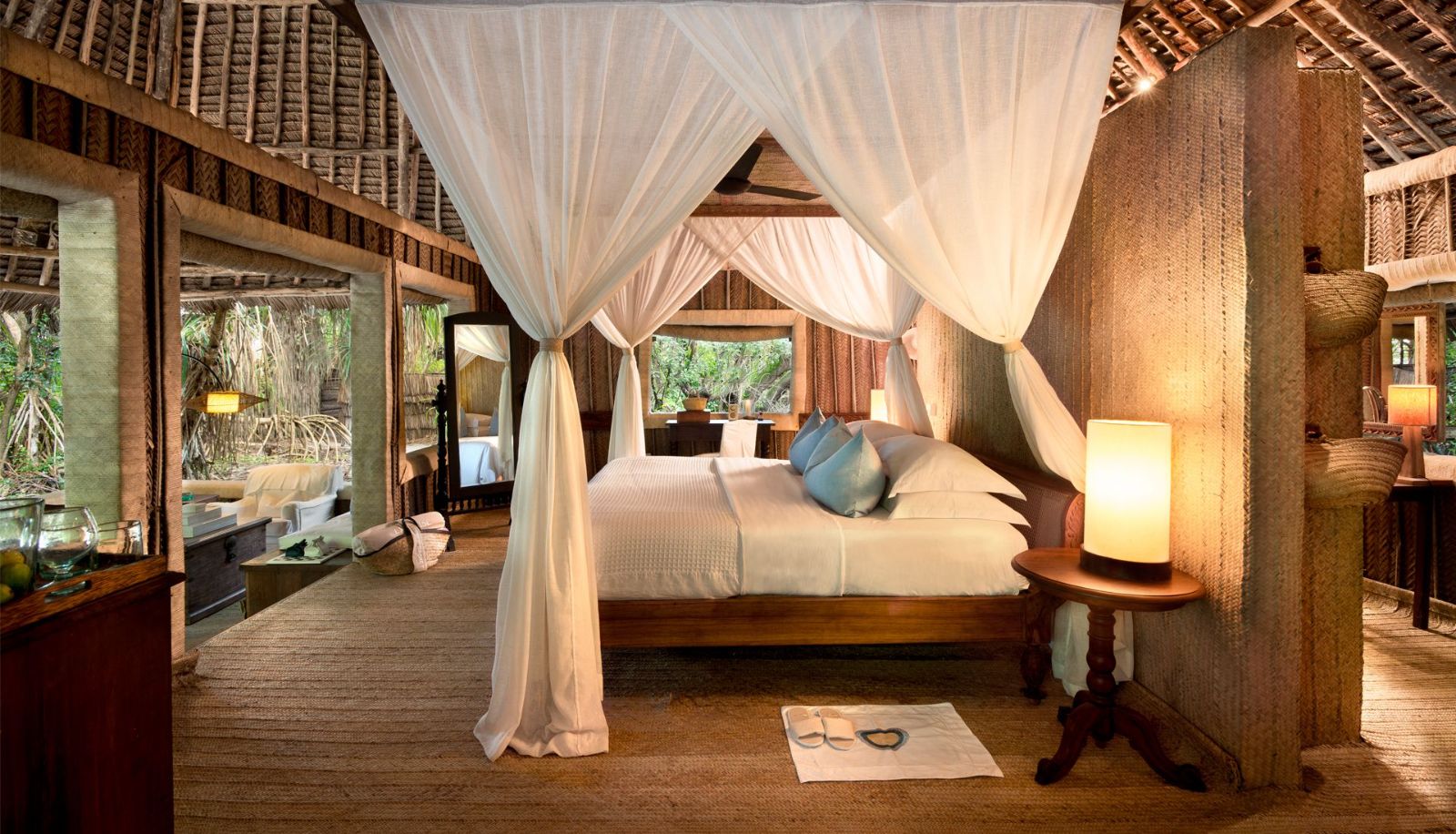 Bedroom in a banda at andBeyond Mnemba Island Lodge, Zanzibar