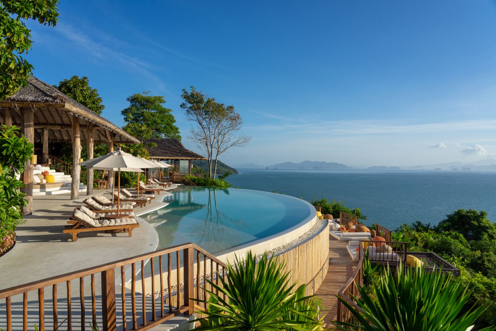 Swimming pool and lounge area at The Hilltop Bar  at luxury resort Six Senses Yao Noi 